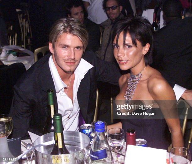 British footballer David Beckham and wife pop star Victoria Beckham attend the MOBO awards at the Royal Albert Hall on October 6, 1999 in London.