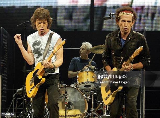 British pop stars Mick Jagger, Keith Richards and Charlie Watts of the rock group "The Rolling Stones" performs on stage on the opening night of...