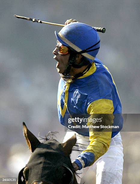 Alex Solis celebrates winning the Classic with horse, Pleasantly Perfect in the $4 Million Breeders' Cup Classic, Powered by Dodge part of the 2003...