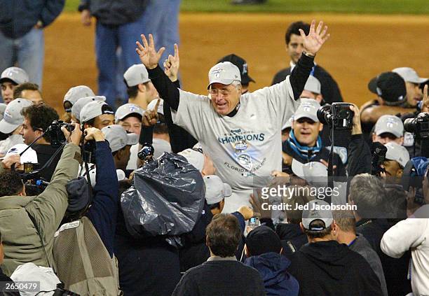 Manager Jack McKeon of the Florida Marlins celebrates with his players after defeating the New York Yankees 2-0 in game six of the Major League...