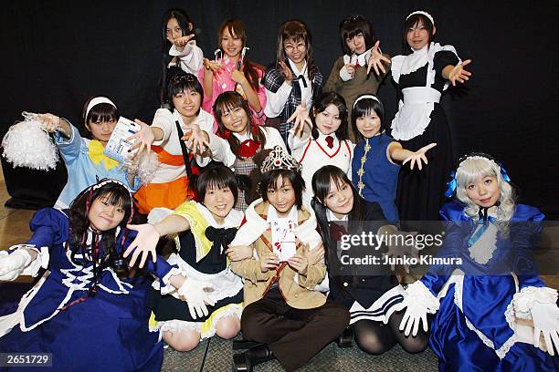 Japanese girls pose in costumes at a Chara Fes event on October 26, 2003 in Tokyo. Cosplay is becoming popular among Japanese youths, whereby...