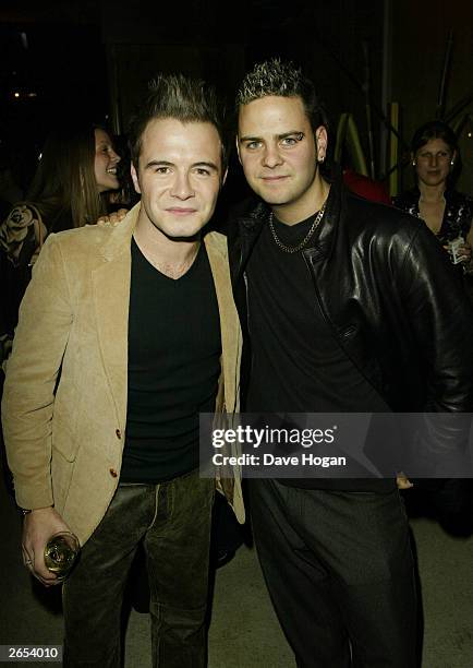 Irish pop star Shane Filan and his friend attend Westlife's "Unbreakable" album launch at the Zuma Restaurant on November 11, 2002 in London.