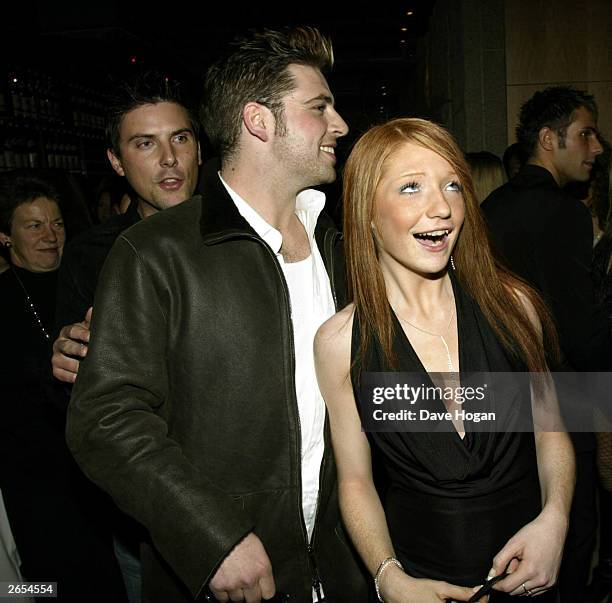 British and Irish pop stars Mark Feehily and Nicola Roberts of the pop groups "Girls Aloud" and "Westlife" attend the "Unbreakable" album launch at...