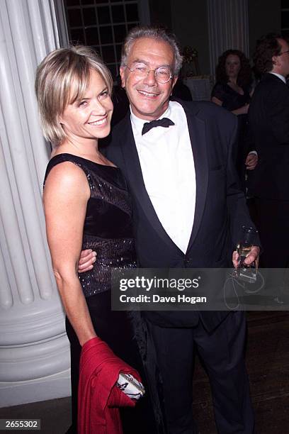 British television presenter Mariella Frostrup and Michael White arrive at the "Enigma" premiere party at Whitehall Rooms on August 18, 2001 in...