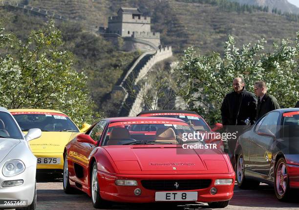 Fleet of Ferraris sports cars line up with the background of the Great Wall of China at Juyongguan, in the suburbs of Beijing, 27 October 2003....