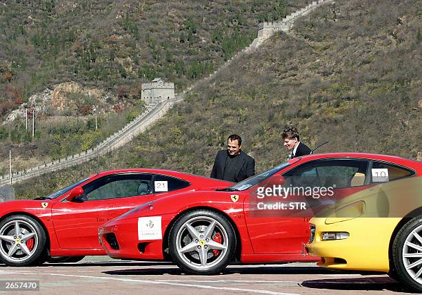 Fleet of Ferraris sports cars line up with the background of the Great Wall of China at Juyongguan, in the suburbs of Beijing, 27 October 2003....