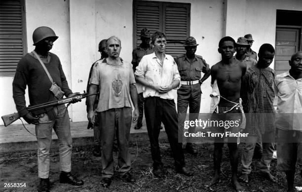 John Downing-Tractor, a company rep, and William Blakeley, a marine manager, after they had been captured and beaten up by Nigerian Federal Troops...
