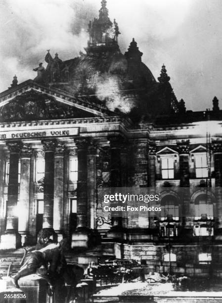 The Reichstag building on fire after an arson attack, Berlin, 27th February 1933. The event, which Adolf Hitler blamed on the Comintern at the time,...