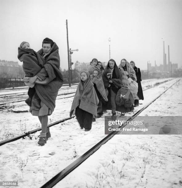 Handful of survivors from the 150 refugees who left Lodz in Poland two months earlier headed for Berlin. They are following railway lines on the...