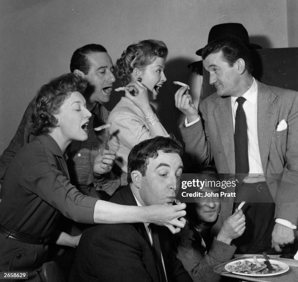 The stars of the television show 'Idiot Weekly': June Whitfield, Max Geldray, Pattie Lewis, Graham Stark; and, sitting, Peter Sellers and Kenneth...