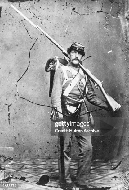 Union infantryman in uniform, carrying a large rifle and bayonet.