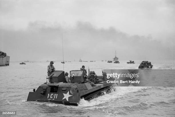 Marines in amphibious assault craft moving towards Inchon in the first counter-attack of the Korean War, during a heavy bombardment of coastal...