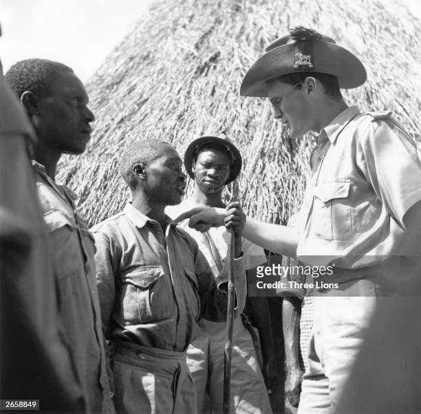 The lieutenant of the Kenyan Constabulary issuing instructions for a raid on a village where Mau Mau raiders were thought to live.