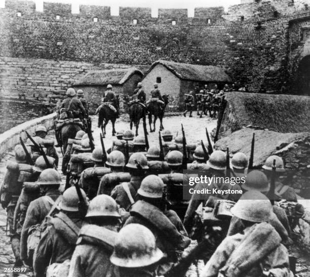 Japanese troops entering Manchuria in the wake of the so-called Mukden Incident during the Sino-Japanese War.