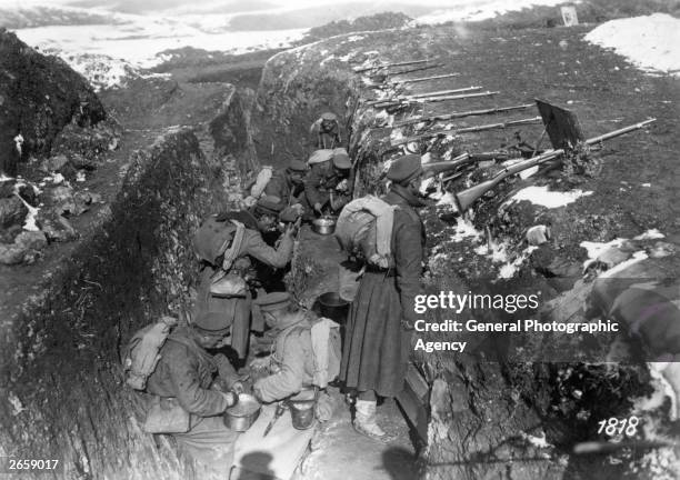 Bulgarian troops having a meal in a trench on the Doiran front.