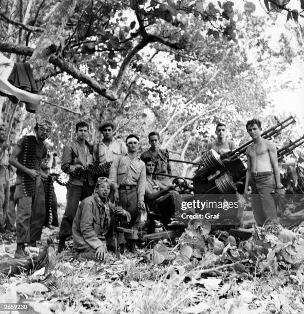 Group of Cuban revolutionary Fidel Castro's soldiers with artillery after routing the US-backed invasion at the Bay of Pigs.