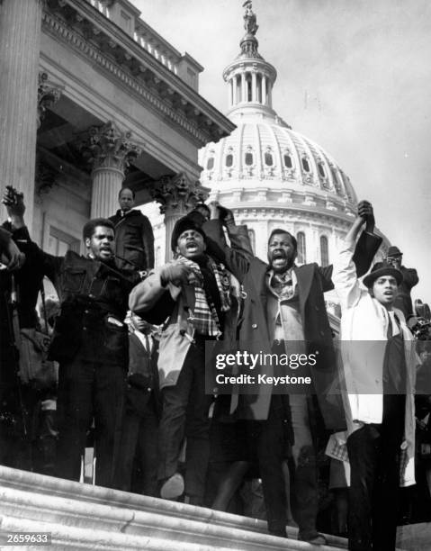 Supporters of Adam Clayton Powell, the Harlem congressman who was denied his seat in the House of Representatives, demonstrate on the House of...
