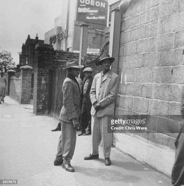 Two immigrants from Jamaica in Clapham, south London, where they are staying in A converted air-raid shelter under Clapham South tube station, while...
