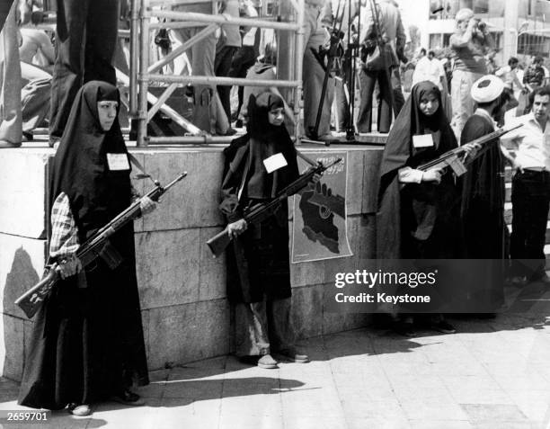 Armed women on guard and participating in Khordad in one of the main squares in Tehran at the beginning of the Iranian Revolution.