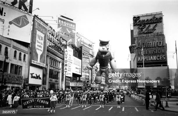 Thanksgiving parade in New York. Floating above the majorettes is a giant inflatable Popeye.