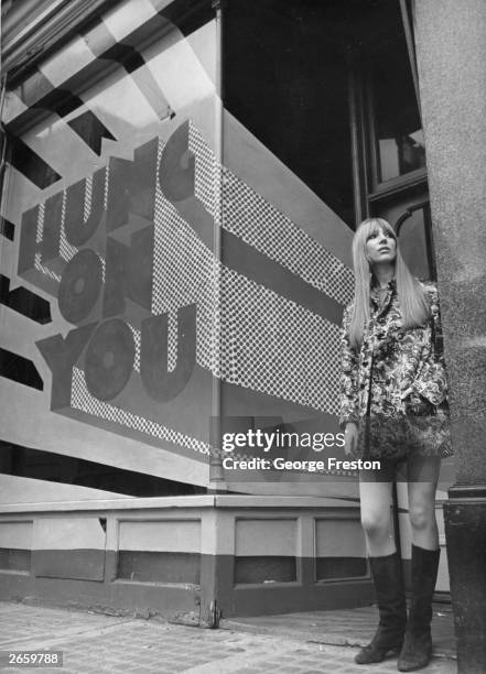 Fashionably dressed young woman outside Hung on You, a boutique in Cale Street, Chelsea, London, 10th February 1967.