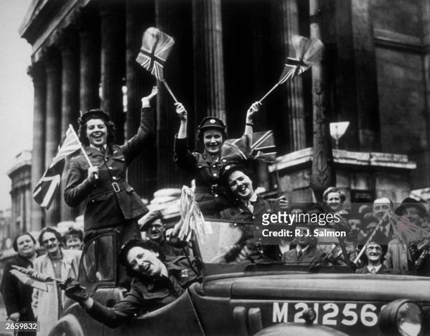Members of the Auxiliary Territorial Service , driving through Trafalgar Square in a service vehicle during the VE Day celebrations in London, 8th...