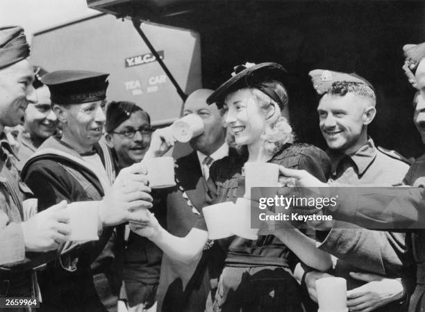 Forces Sweetheart Vera Lynn, acting on behalf of the Variety Artistes Ladies' Guild, presented a mobile canteen to the mayor of Westminster who...