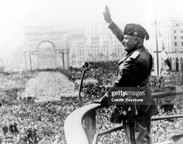 Italian dictactor Benito Mussolini saluting during a public address.