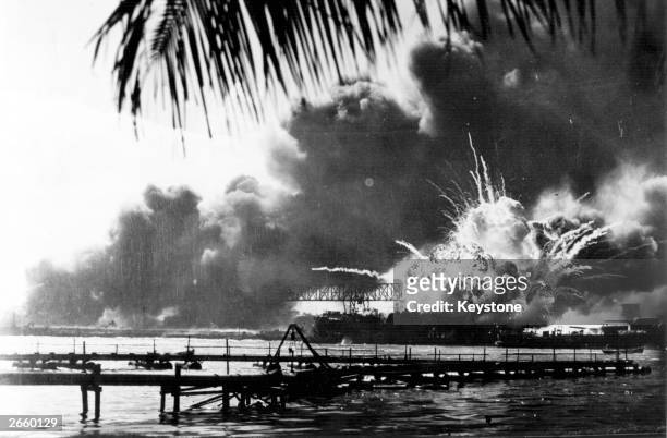 The American destroyer USS Shaw explodes during the Japanese attack on Pearl Harbor, home of the American Pacific Fleet during World War II, 7th...