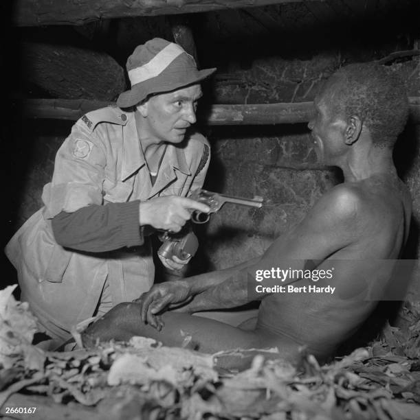 Night raid organised by the Army and the Kenya police to find members of the Mau Mau, November 1952. Original Publication: Picture Post - 6223 - Mau...