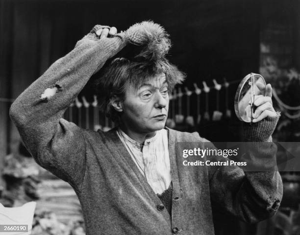 Actress Betty Marsden ruffling up her hair before rehearsals for 'Everybody Loves Opal', in which she played an eccentric junk collector, in Britain.
