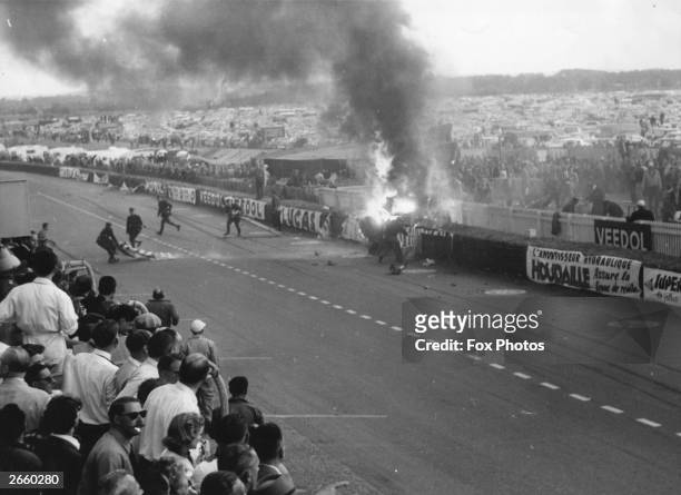 The scene of the crash at Le Mans racing circuit, after Pierre Levegh's Mercedes-Benz 300 SLR spun out of control and exploded into the tightly...