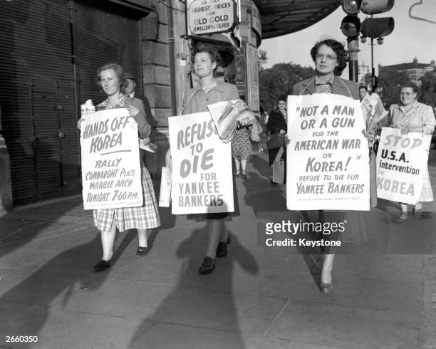 Women with placards demonstrating against the Korean War, as part of the Communist Peace Demonstration held at Marble Arch London.