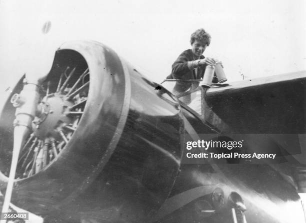 American aviator Amelia Earhart in the cockpit of her aeroplane at Culmore, near Derry, Ireland, after her solo Atlantic flight.