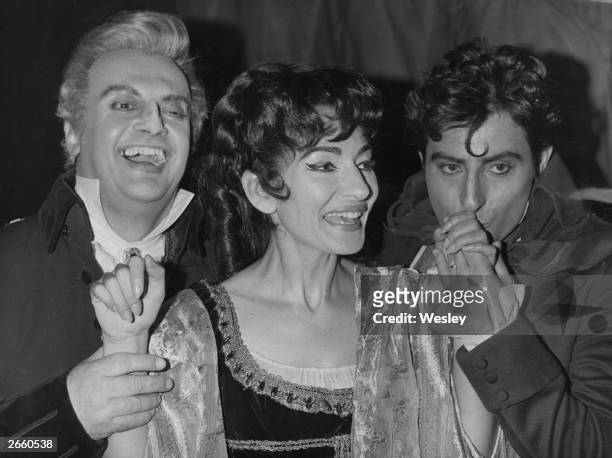 Prima donna Maria Callas with co-stars Tito Gobbi and Renato Cioni, after her triumphant performance in Tosca, at the Royal Opera House, Covent...