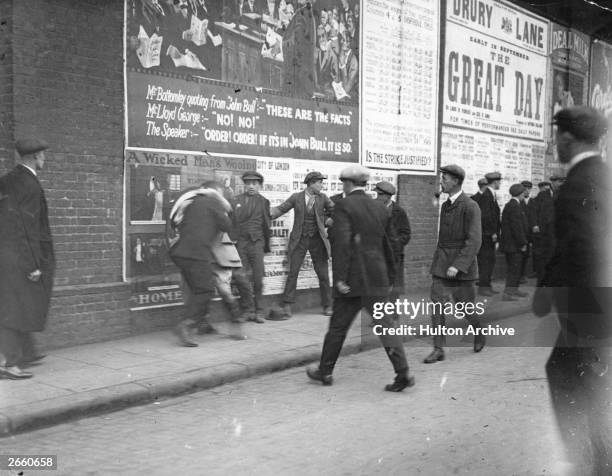 Blackleg', or volunteer worker, is attacked in the street by strikers at the York Road railway stables, London, during the Great Railway Strike.