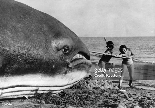 Two proud 'anglers' seen here with the giant plastic whale used in the film 'Hercules', original title 'Le Fatiche di Ercole'. The film was directed...