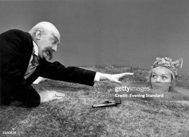 Brenda Bruce and Peter Duguid in a scene from Samuel Beckett's play 'Happy Days' at the Royal Court Theatre, London.