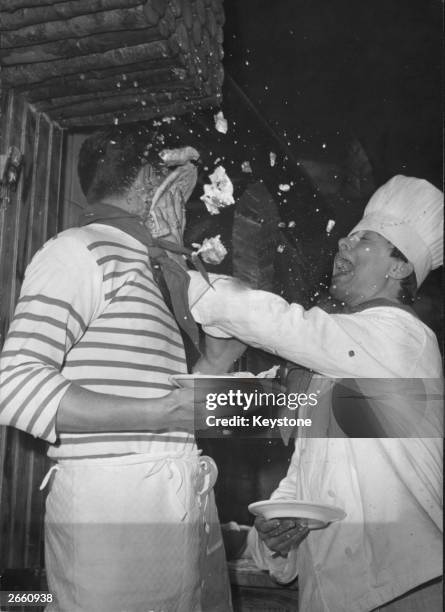The loser of Paris' 'best pizza-maker' competition, splattering his entry in the face of the winner.