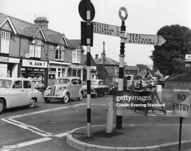 Queue of traffic waiting at a roundabout in Sevenoaks, Kent.