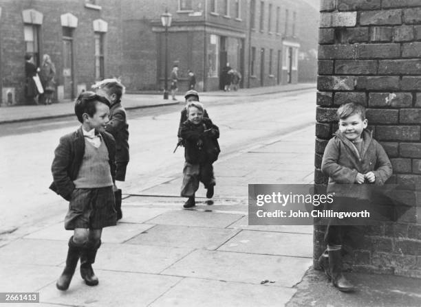 Group of cheeky children playing in the streets of Belfast. Original Publication: Picture Post - 7029 - The Best And The Worst Of Some British Cities...