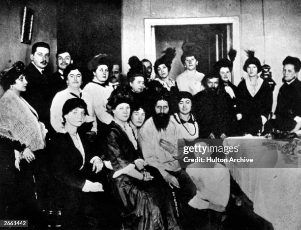 Russian mystic and self-styled holy man Grigory Yefimovich Rasputin surrounded by his court followers. Amongst them are Sana Pistolkors, A. E....