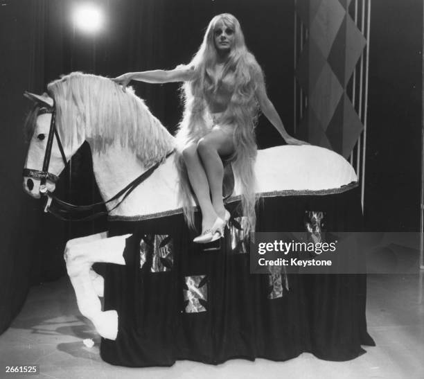 Female impersonator Danny La Rue as Lady Godiva in 'A Tribute to Coventry'.