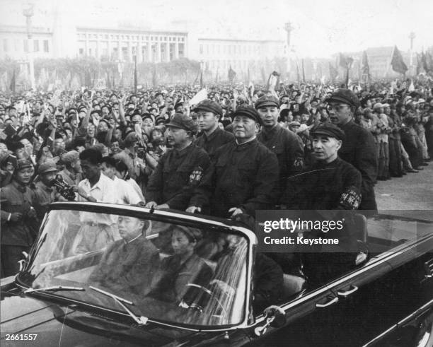 Chinese leader Mao Tse-tung , accompanied by his second-in-command Lin Biao , passes along the ranks of revolutionaries during a rally in Tiananmen...