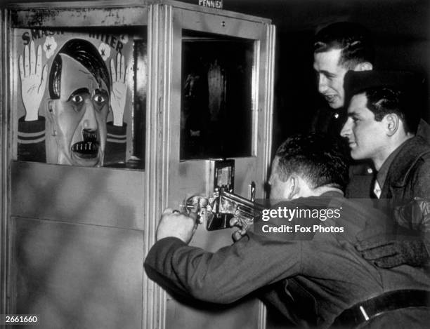 Hitler Rim Shot American soldiers take pot shots at a caricature of Adolf Hitler, in ...
