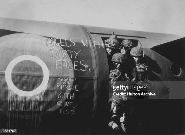 Paratroopers give the thumbs-up signal, before leaving in a glider to drop on Normandy as reinforcements to the invasion forces.
