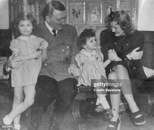 From the photograph album of Eva Braun, discovered in Frankfurt, a picture of her relaxing with her husband, German fascist dictator Adolf Hitler,...