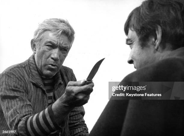 Anthony Quinn threatens Richard Johnson with a knife in a scene from the movie 'L'Avventuriero' , based on the Joseph Conrad novel. It was filmed on...
