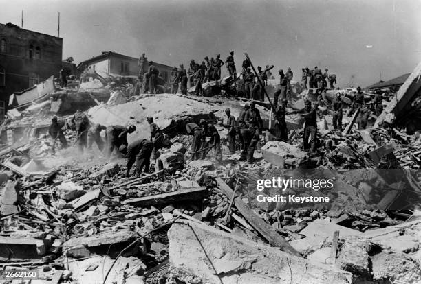 Soldiers in Skopje, Yugoslavia, digging for bodies in the ruins left by the earthquake.