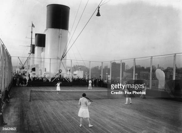 Passengers playing tennis aboard the liner SS Cap Areona.
